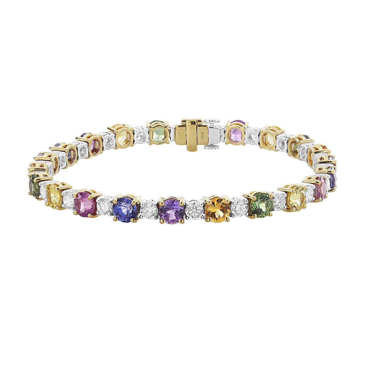 Mixing together diamonds, sapphires and yellow and white gold. A different type of stack, but we like it!