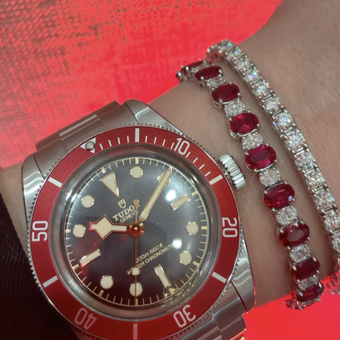 The TUDOR Black Bay with red bezel pairs perfectly with our London Collection diamond and ruby bracelets